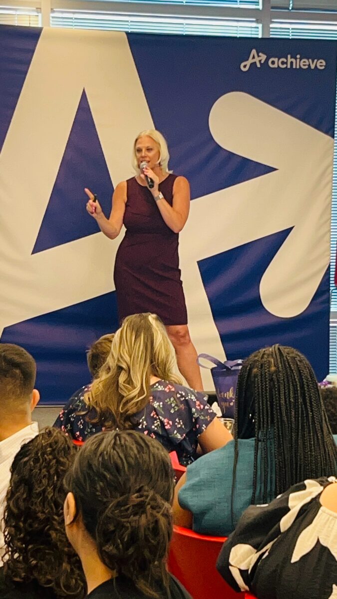 Jessica presenting at Achieve corporate event