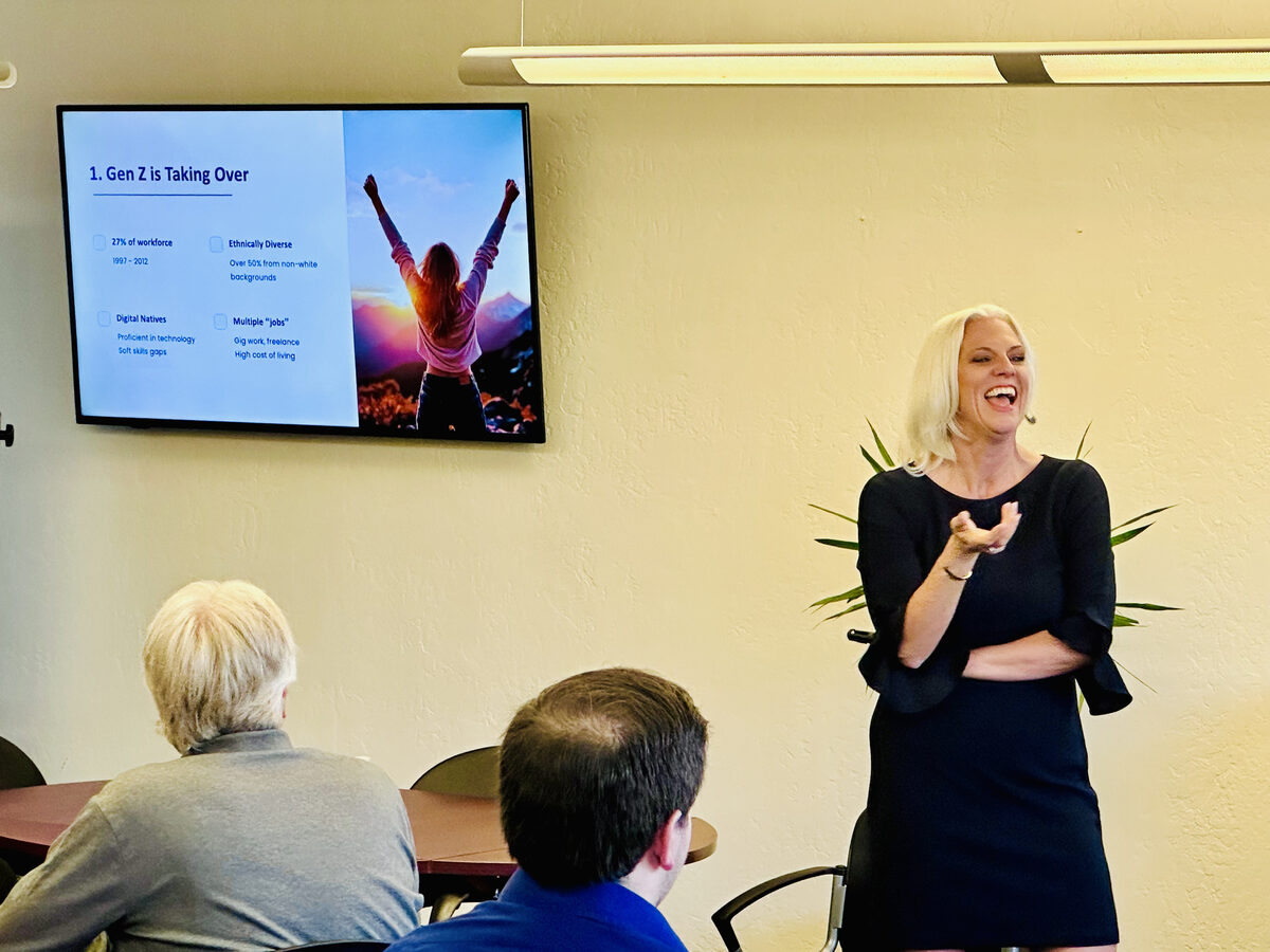 Jessica on stage at ASU speaking about networking